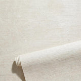 A blank roll of natural grasscloth wallpaper showcasing uneven organic texture