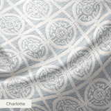 Geometric pattern with ornate circular medallions in gray and white, resembling vintage tile design