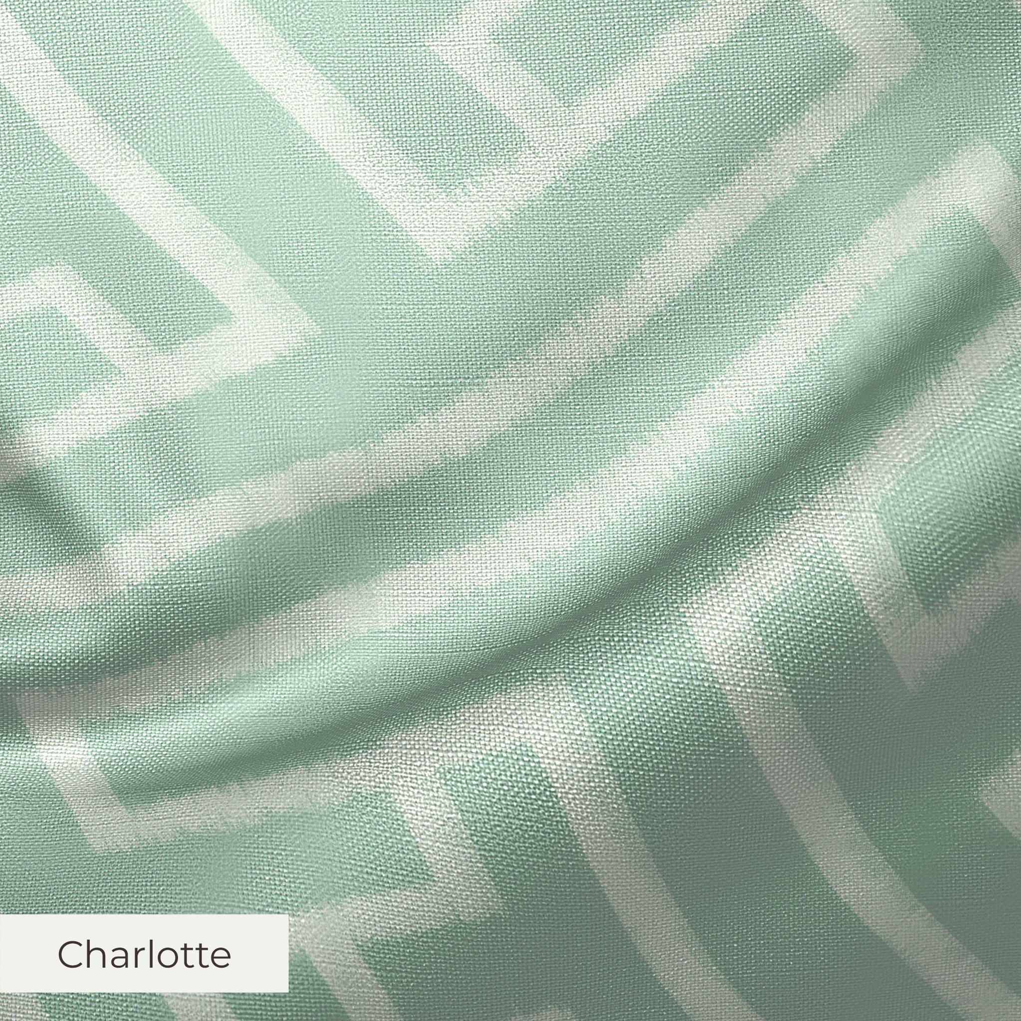 Greek key pattern in sage green and cream with geometric interlocking maze design