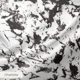 Abstract black and white speckled texture with irregular organic patterns and high contrast