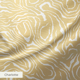 Gold and white swirling abstract pattern with flowing organic lines resembling wood grain or marbled