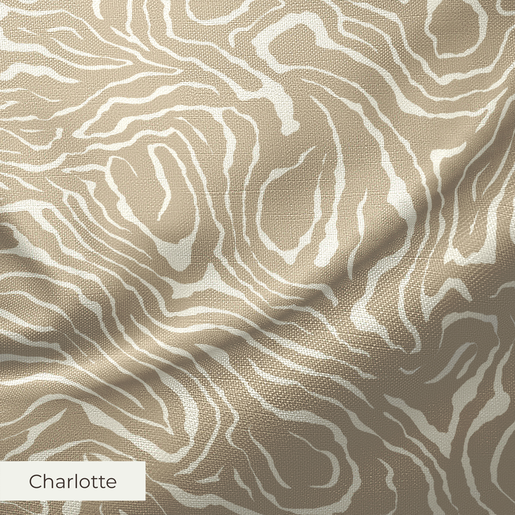 Swirling abstract pattern in tan and white resembling wood grain or marble texture