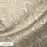 Swirling abstract pattern in tan and white resembling wood grain or marble texture