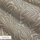 Swirling abstract pattern in tan and white resembling wood grain or marble texture