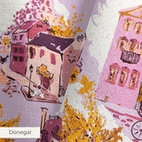 Whimsical autumn town scene with pink and purple buildings, golden trees, and people on streets