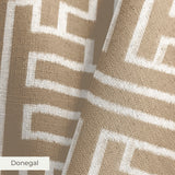 Greek key pattern in white on beige background with geometric maze-like design