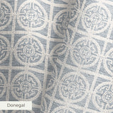 Geometric pattern with ornate circular medallions in gray and white, resembling vintage tile design