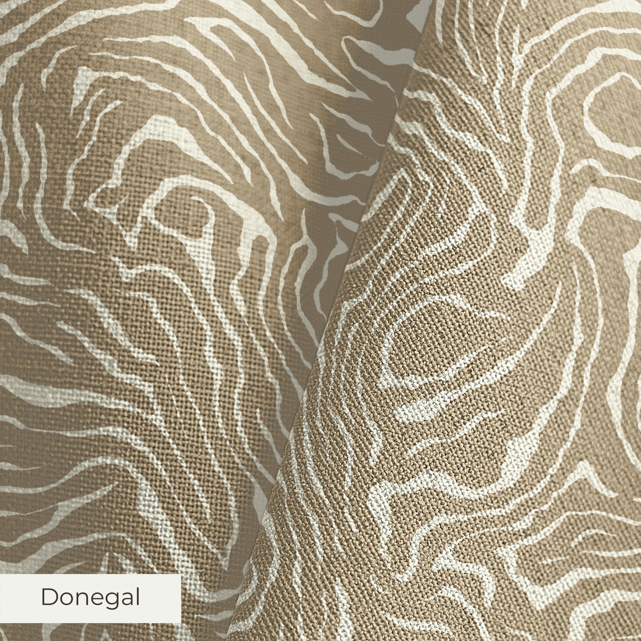 Swirling abstract pattern in tan and white resembling wood grain or marble texture