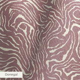 Swirling organic pattern in white lines on mauve-brown background creating flowing abstract texture