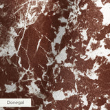 Brown and white speckled pattern with irregular organic shapes creating a mottled texture