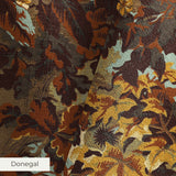 Autumn oak leaves and acorns in brown, gold, and sage green tones creating a dense fall foliage patt