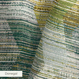Abstract camouflage pattern in teal, gold, cream and gray with horizontal striped texture