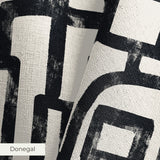 Abstract black geometric maze pattern on cream background with interlocking angular pathways