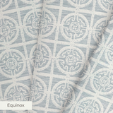 Geometric pattern with ornate circular medallions in gray and white, resembling vintage tile design