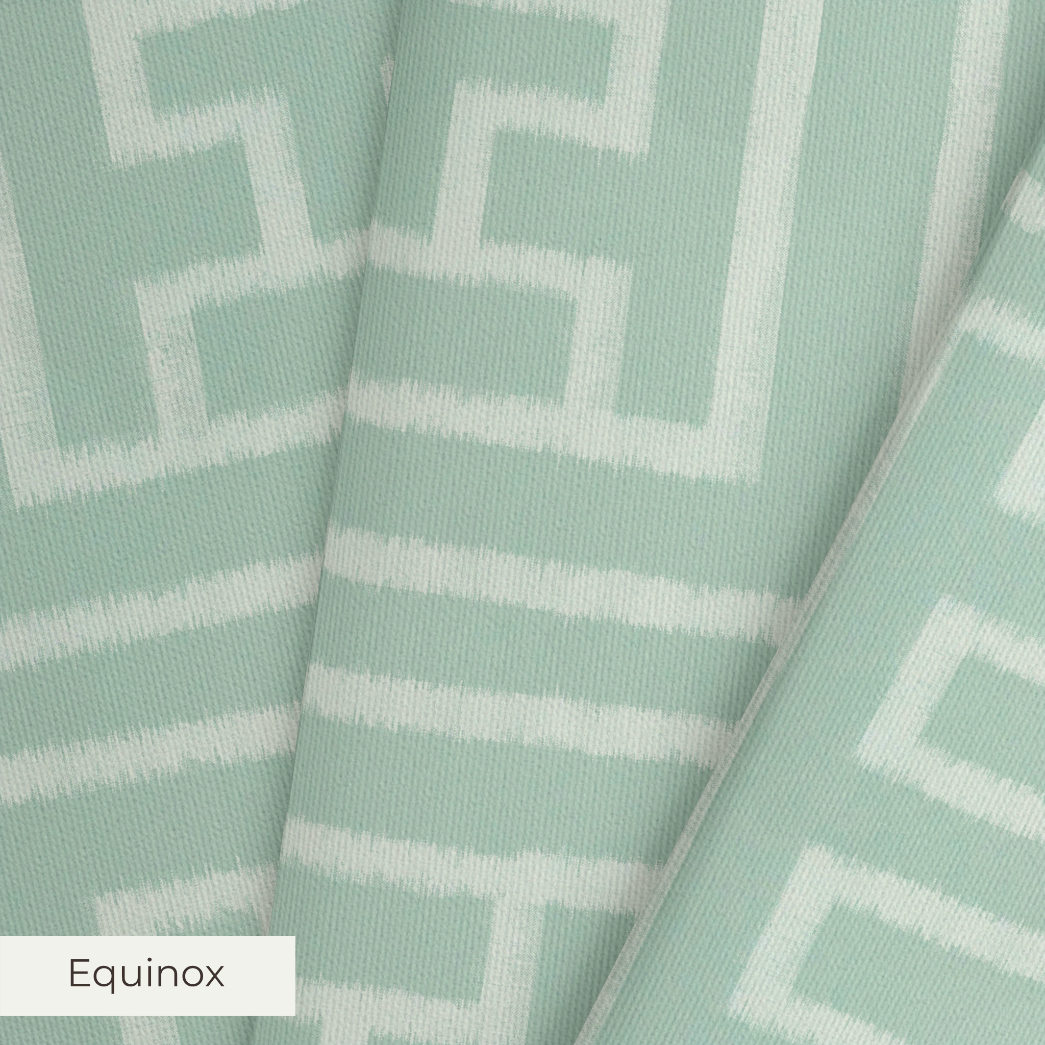 Greek key pattern in sage green and cream with geometric interlocking maze design