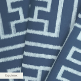 White geometric Greek key pattern on dark blue background