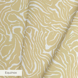 Gold and white swirling abstract pattern with flowing organic lines resembling wood grain or marbled