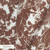 Brown and white speckled pattern with irregular organic shapes creating a mottled texture