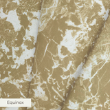 Abstract gold and white mottled pattern with organic shapes and speckled texture