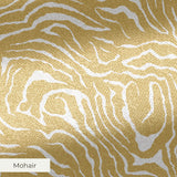 Gold and white swirling abstract pattern with flowing organic lines resembling wood grain or marbled