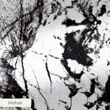 Abstract black and white speckled texture with irregular organic patterns and high contrast