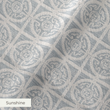 Geometric pattern with ornate circular medallions in gray and white, resembling vintage tile design