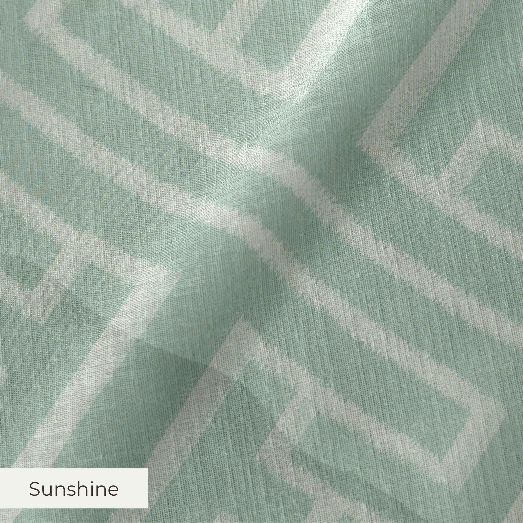 Greek key pattern in sage green and cream with geometric interlocking maze design
