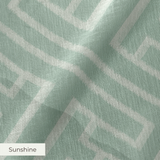 Greek key pattern in sage green and cream with geometric interlocking maze design