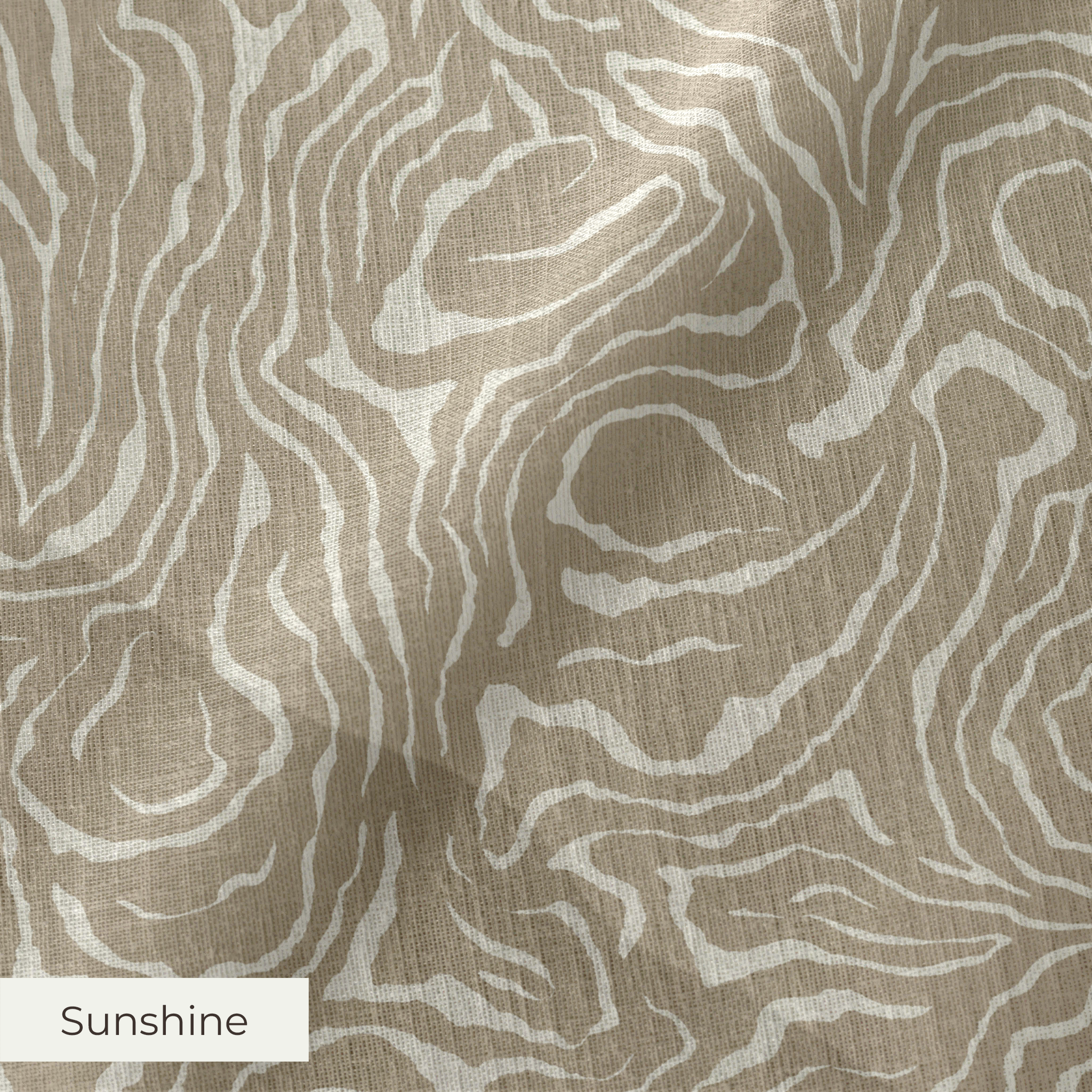 Swirling abstract pattern in tan and white resembling wood grain or marble texture