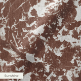 Brown and white speckled pattern with irregular organic shapes creating a mottled texture