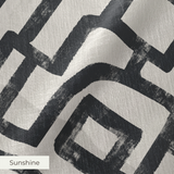Abstract black geometric maze pattern on cream background with interlocking angular pathways