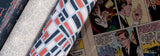 A close-up of patterned Spider-Man fabric rolls laid over a vintage comic book page. The visible fabrics include one with a white spiderweb motif, one with a geometric pattern in navy, white, and coral, and another dark patterned fabric on the left.