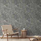 Abstract geometric pattern of intersecting black line segments forming angular shapes on white backg