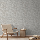 Abstract wavy lines pattern in beige and white tones creating a flowing, organic design