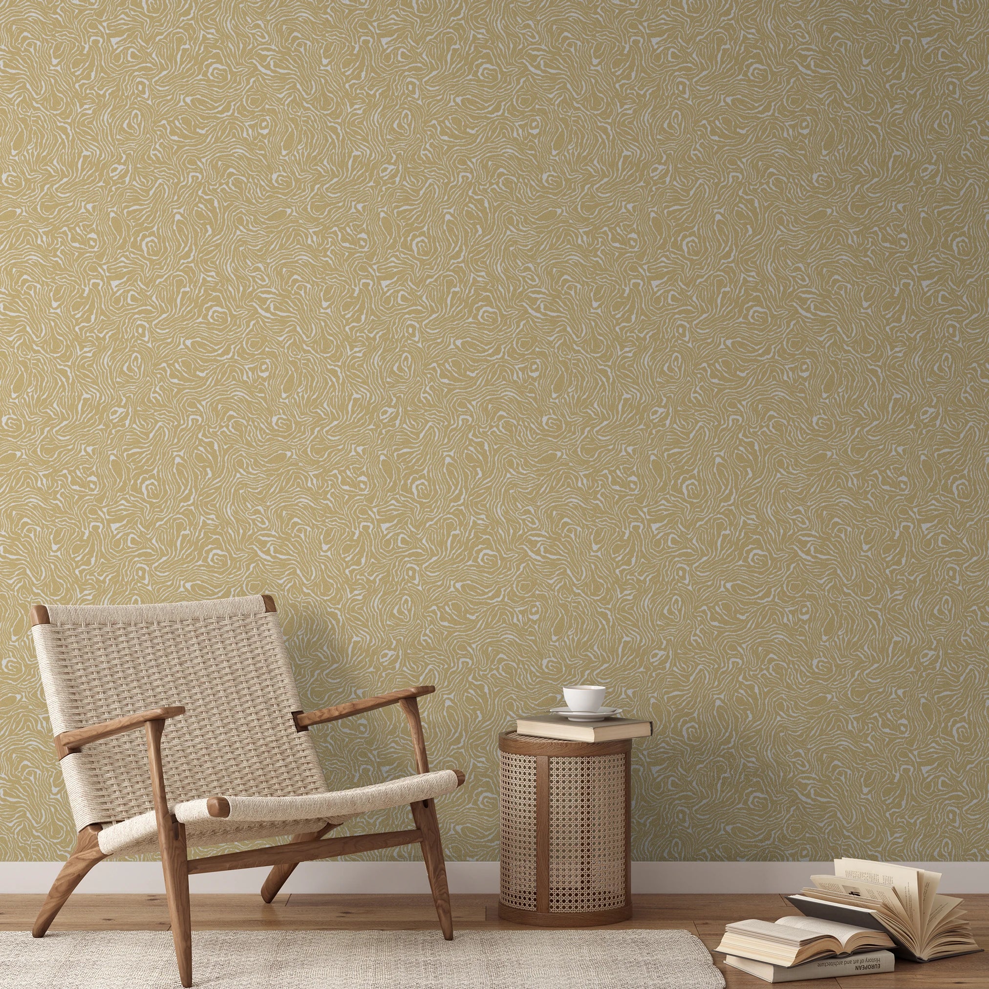 Gold and white swirling abstract pattern with flowing organic lines resembling wood grain or marbled