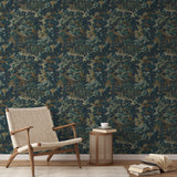 Dark floral wallpaper pattern with gold, cream, and teal leaves and flowers on navy blue background