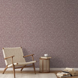 Swirling organic pattern in white lines on mauve-brown background creating flowing abstract texture