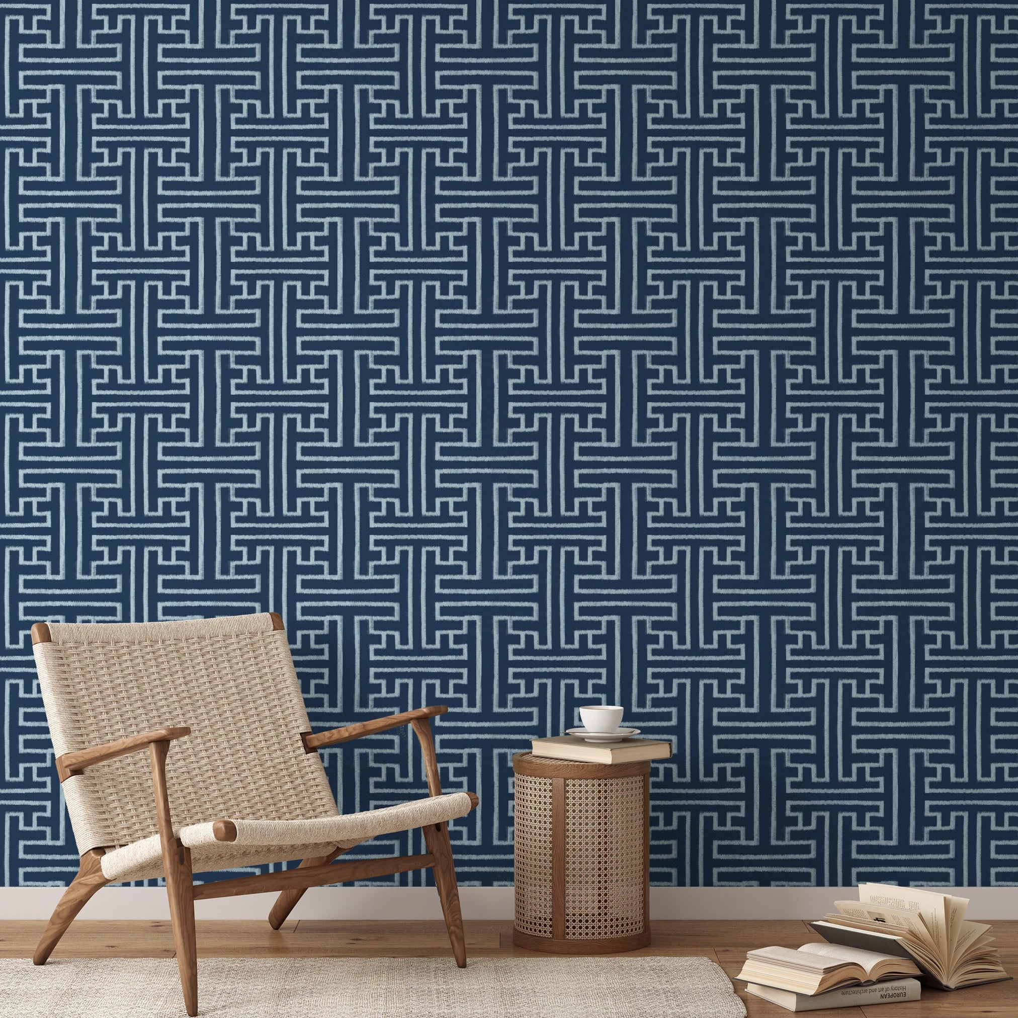 White geometric Greek key pattern on dark blue background