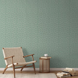 Greek key pattern in sage green and cream with geometric interlocking maze design