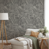 Abstract geometric pattern of intersecting black line segments forming angular shapes on white backg