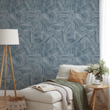 Abstract geometric pattern of intersecting diagonal and vertical lines in blue on white background