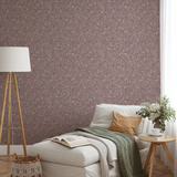 Swirling organic pattern in white lines on mauve-brown background creating flowing abstract texture