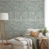 Gray and white geometric pattern with intersecting angular lines and stripes forming abstract triang