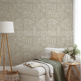 Geometric pattern with beige and cream angular lines forming abstract triangular shapes on light bac