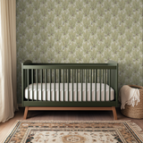 Pastoral wallpaper pattern with green trees and grazing sheep on cream background