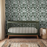 Geometric pattern with green, white, and gray blocks, stripes, and decorative floral motifs in recta