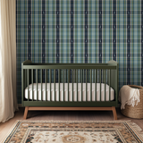 Plaid pattern in navy, gray, teal and yellow with white deer silhouettes on navy stripes