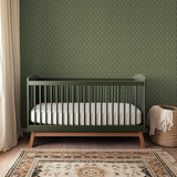 Green geometric pattern with white starburst motifs radiating from dots in repeating grid
