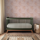 Delicate botanical pattern with ferns and leaves in pink, orange, and white tones on blush backgroun