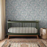 Intricate paisley pattern in blue and gray tones on cream background with flowing botanical motifs